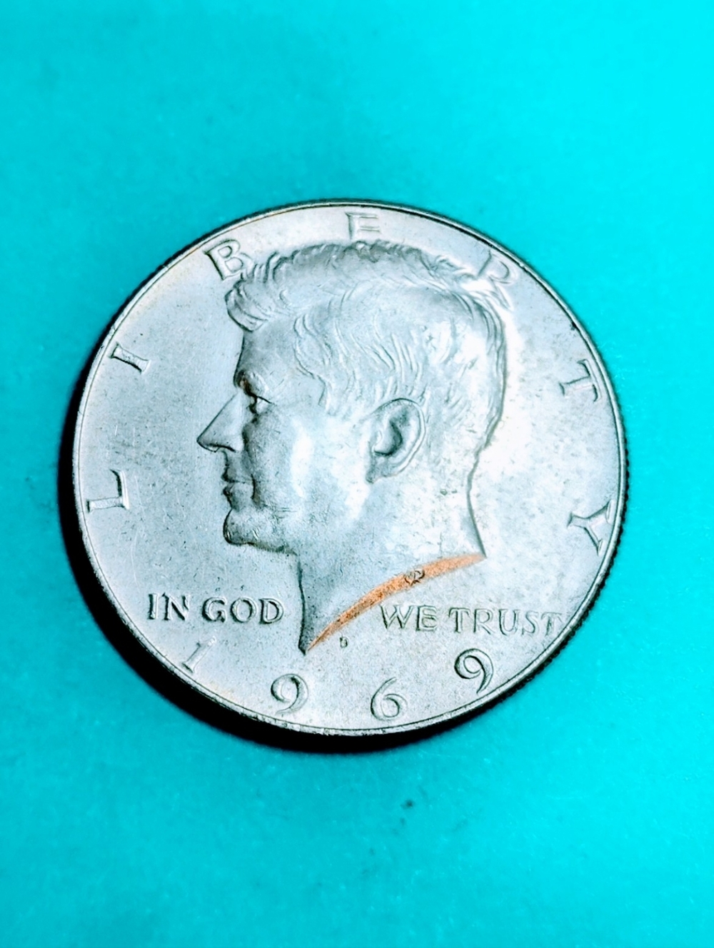 1969-D 40% Silver Kennedy Half Dollar In Very Good Circulated Condition.